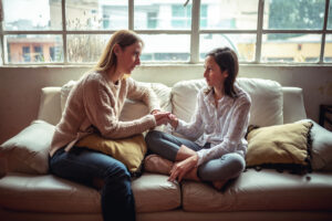 Woman talking with teenage daughter after reading What to Do if You Find Drugs in Your Child's Room
