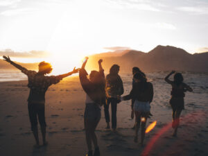 group of teens on beach enjoying teen drug counseling in California